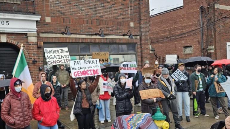Irish- and Jewish-American protesters out Rep. Pat Ryan's office, holding the Irish tricolor flag, on 2 March in Newburgh, New York.