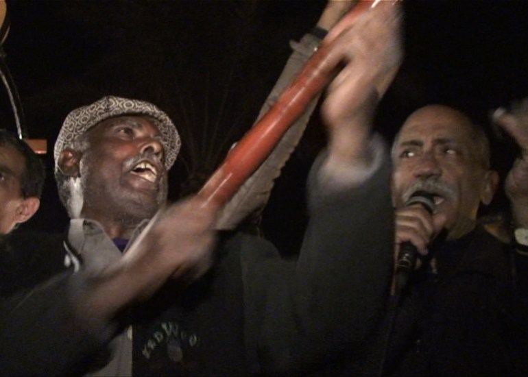 Zakaria singing to encourage the revolutionaries in Tahrir Square in 2011
