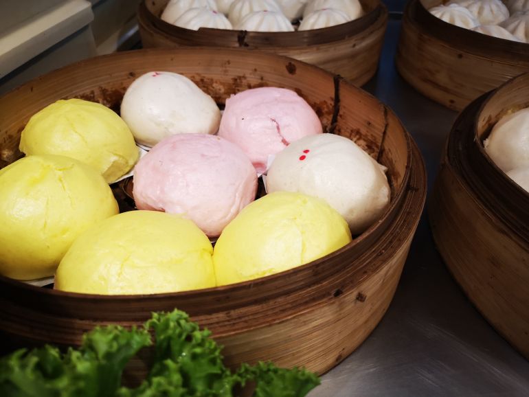 Pink and yellow steamed buns