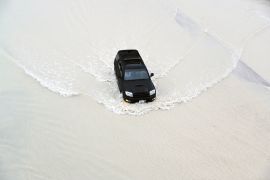 Motorists drive during heavy rainfall in Dubai, United Arab Emirates [Ali Haider/EPA]