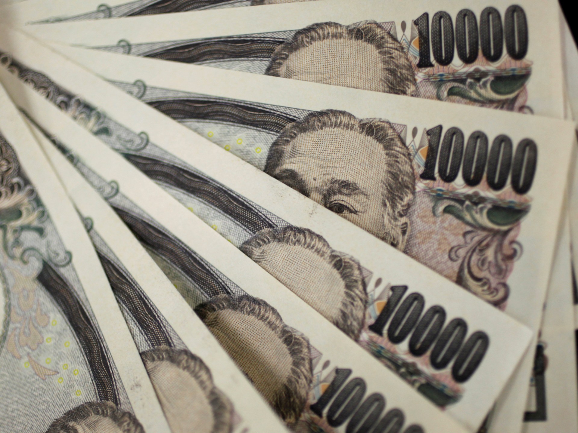 Japan’s yen plunges to lowest level against the dollar since 1990