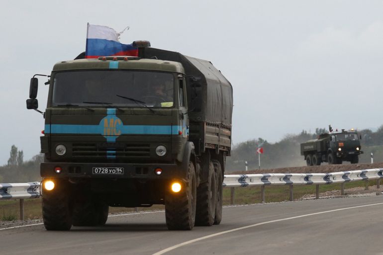 Russian peacekeepers drive trucks in direction towards the Armenia-Azerbaijan border