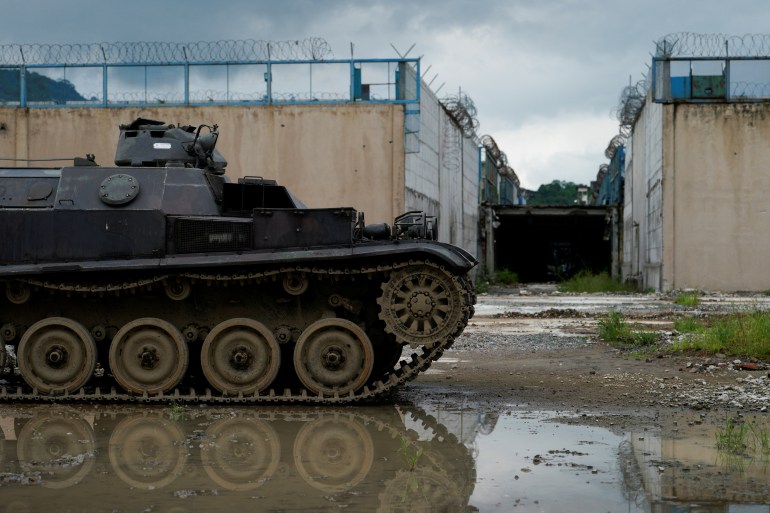 A tank sits in front of a Guayaquil prison