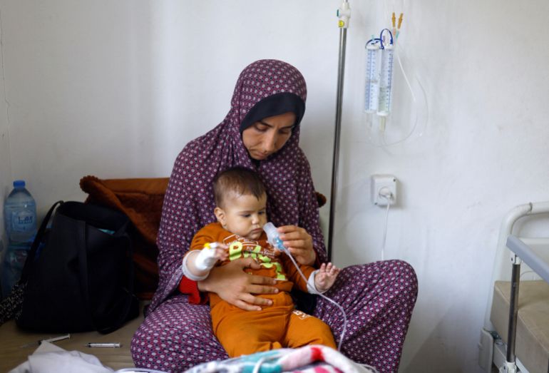 A Palestinian child suffering from malnutrition receives treatment at al-Awda health centre