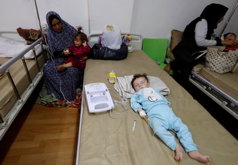 A Palestinian child suffering from malnutrition receives treatment at al-Awda health centre