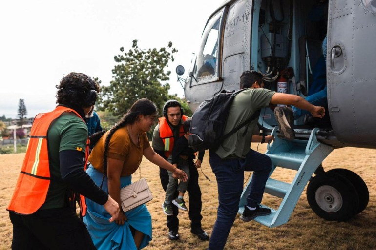 Mexican citizens board an helicopter as they are evacuated from Haiti by personnel of the Mexican Navy, in Port-au-Prince on Monday. (Mexican Foreign Ministry Handout Photo via Reuters)