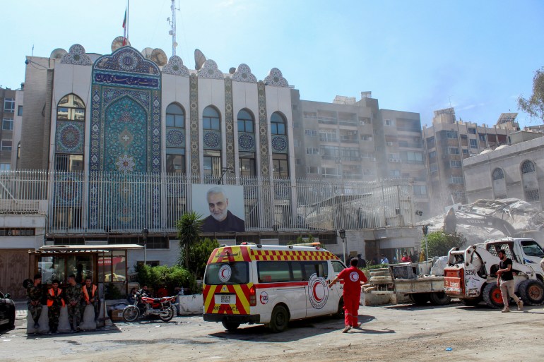 An ambulance is parked outside the Iranian embassy after a suspected Israeli strike on Monday on Iran's consulate, adjacent to the main Iranian embassy building, which Iran said had killed seven military personnel including two key figures in the Quds Force, in the Syrian capital Damascus