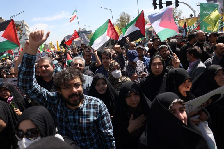 Iranians attend a rally