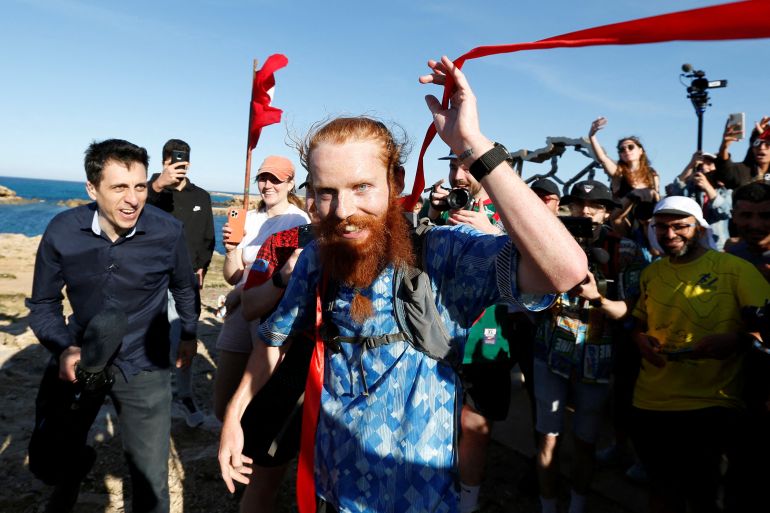 Britain's Russ Cook becomes the first person to run the entire length of Africa - Tunisia - April 7, 2024 Britain's Russ Cook reacts after becoming the first person to run the entire length of Africa.
