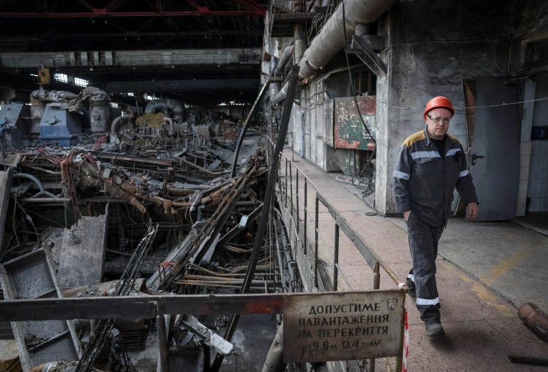 A worker walks at a thermal power plant damaged by recent Russian missile strike, amid Russia's attack on Ukraine, in an undisclosed location of Ukraine April 8, 2024. REUTERS/Gleb Garanich