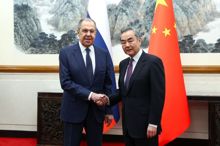 Russia's Foreign Minister Sergei Lavrov shakes hands with China's Foreign Minister Wang Yi during a meeting in Beijing, China April 9, 2024. Russian Foreign Ministry/Handout via REUTERS ATTENTION EDITORS - THIS IMAGE WAS PROVIDED BY A THIRD PARTY. NO RESALES. NO ARCHIVES. MANDATORY CREDIT.