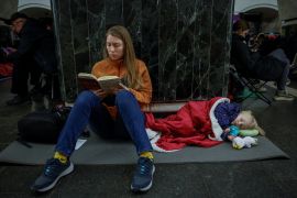 Yuliia, a Ukrainian woman, takes shelter inside a metro station with her daughter Varvara during a Russian missile attack in Kyiv, Ukraine [Alina Smutko/Reuters]