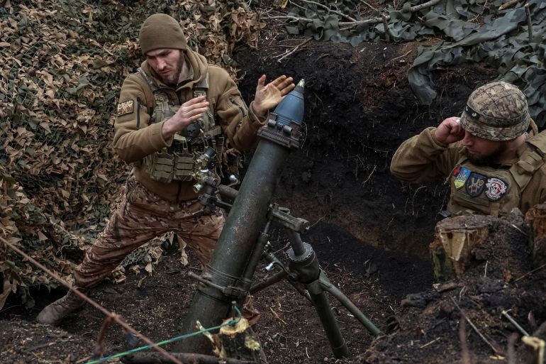  Ukrainian servicemen of the 28th Separate Mechanized Brigade fire a 120-mm mortar towards Russian troops at a frontline