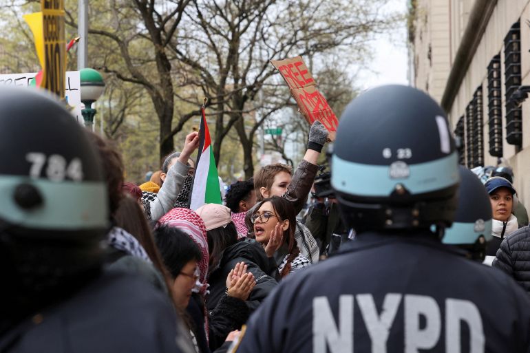 Law enforcement officers stand guard as demonstrators protest in solidarity with Pro-Palestinian organizers on the Columbia University campus, amid the ongoing conflict between Israel and the Palestinian Islamist group Hamas, in New York City, U.S., April 18, 2024. REUTERS/Caitlin Ochs