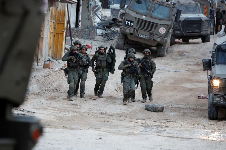 Israeli soldiers operate during a raid, at Nour Shams camp, in Tulkarm, in the Israeli-occupied West Bank, April 20, 2024. REUTERS/Raneen Sawafta