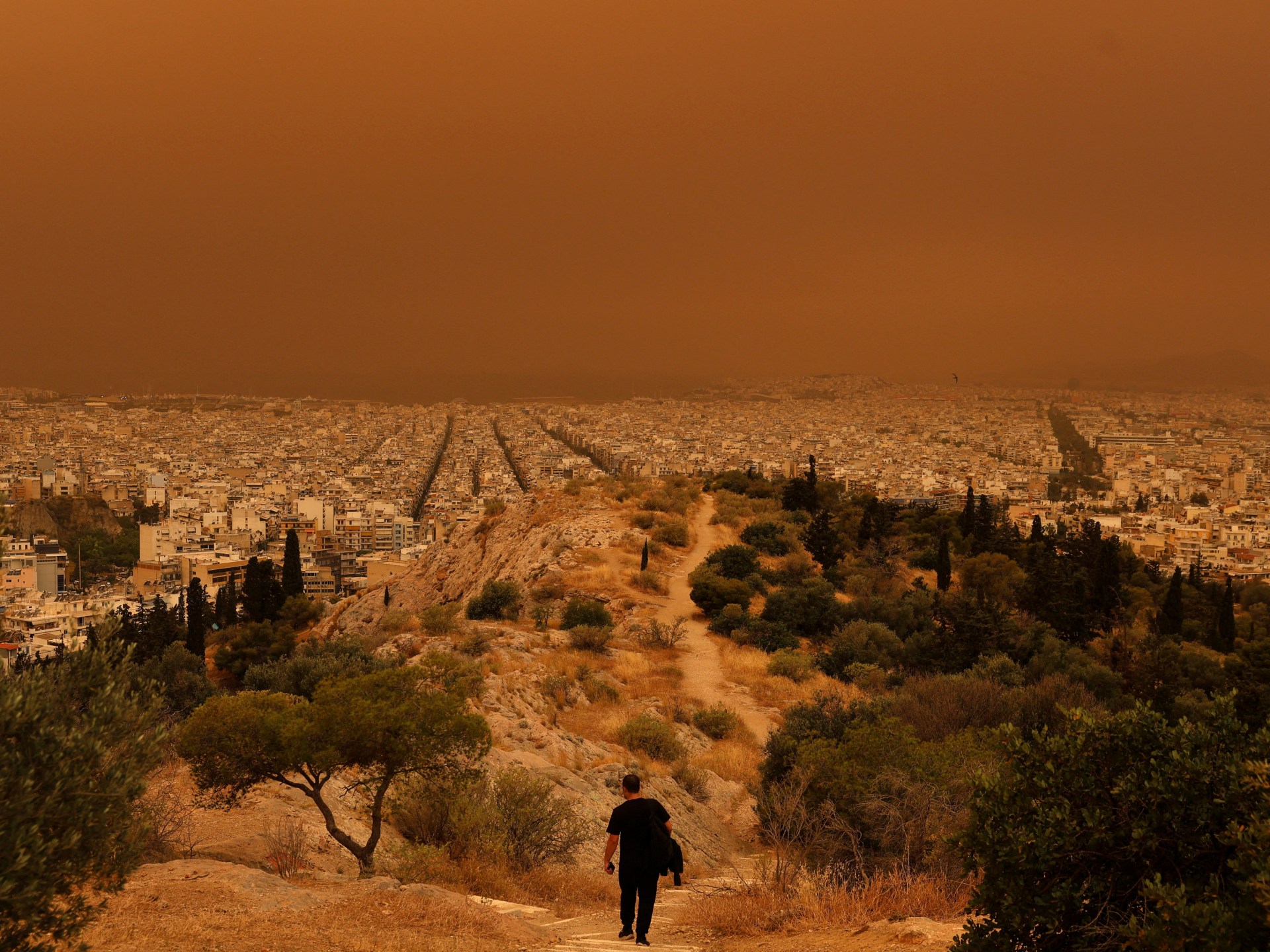 Dust storm turns sky orange over Athens