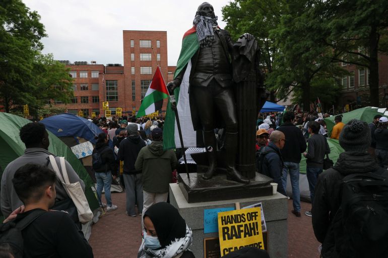 A statue with a Palestinian keffiyeh is pictured as students and others demonstrate at a protest encampment at University Yard in support of Palestinians in Gaza, during the ongoing conflict between Israel and the Palestinian Islamist group Hamas, at George Washington University in Washington, U.S., April 25, 2024. REUTERS/Leah Millis