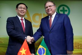 Vuong Dinh Hue is seen here meeting Brazil&#039;s Agriculture Minister Blairo Maggi in Brazil, in his then-capacity as deputy prime minister [File: Adriano Machado/Reuters]