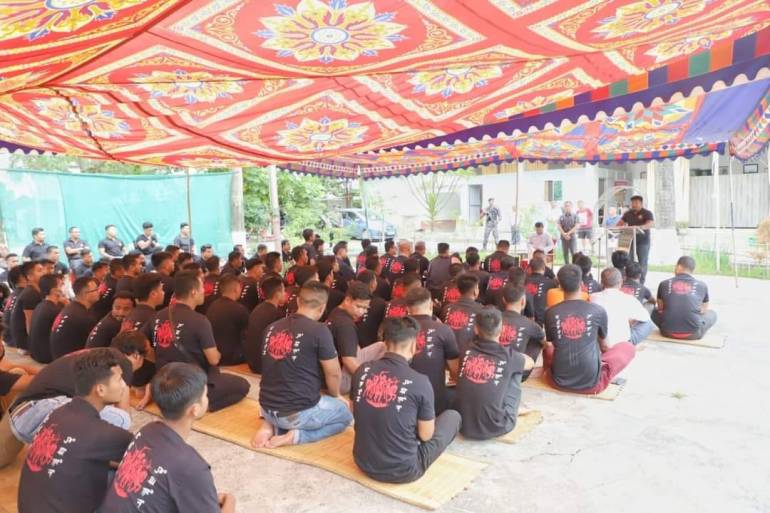 A picture posted on Facebook from September 2022 by the commander of the group Tyson Ngangbam shows him addressing men in black t-shirts with the signature logo of three pony-riding warriors