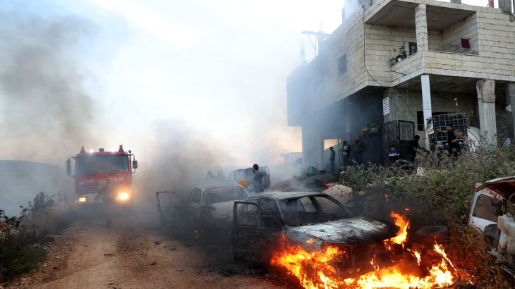 A view of damaged houses and burning vehicles after a raid by Jewish settlers on the Mughir town near Ramallah, West Bank on April 12