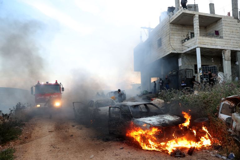 A view of damaged houses and burning vehicles after a raid by Jewish settlers on the Mughir town near Ramallah, West Bank on April 12