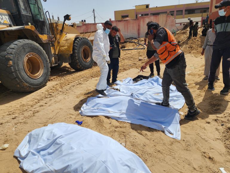 KHAN YOUNIS, GAZA - APRIL 24: (EDITORS NOTE: Image depicts death) Civil Defense teams uncover 51 more bodies on Wednesday from a mass grave at Nasser Hospital in Khan Younis city in the southern Gaza Strip on April 24, 2024. At least 334 bodies found in mass grave at Nasser Hospital in Khan Younis, according to Palestinian officials. “Some 30 victims have been identified, while efforts are still underway to identify the others,” Ismail al-Thawabta, the director-general of Gaza’s government media office, told Anadolu. The bodies were discovered after the Israeli army withdrew from Khan Younis on April 7 following a 4-month ground offensive in the city. ( Hani Alshaer - Anadolu Agency )