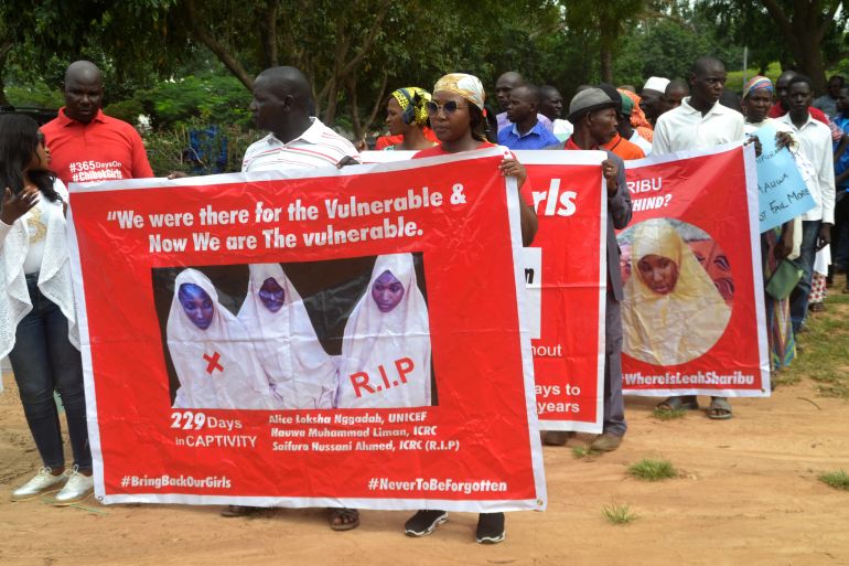 Members of the Bring Back Our Girls (BBOG) advocacy group take part in a protest in the Nigerian capital Abuja on October 16, 2018, following the killing of a kidnapped female Red Cross worker by Islamic State-allied Boko Haram jihadists.