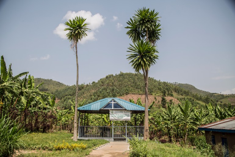 A memorial to those who lost their lives during the 1994 genocide in Rwanda stands in the valley that separates two villages on adjascent hills, at the border between Musambira and Nyarubaka sectors of Kamonyi District, on March 4, 2019. Two villages on adjascent hills are re-learning to share all they have, including a well-spring at the bottom of the valley, after 1994 genocide. More than a thousand residents of the town were massacred in the days following the outbreak of inter-ethnic violence, a genocide in which over 800,000 mostly Tutsi people were slaughtered between April to July 1994, according to the UN.[Jacques Nkinzingabo/AFP]