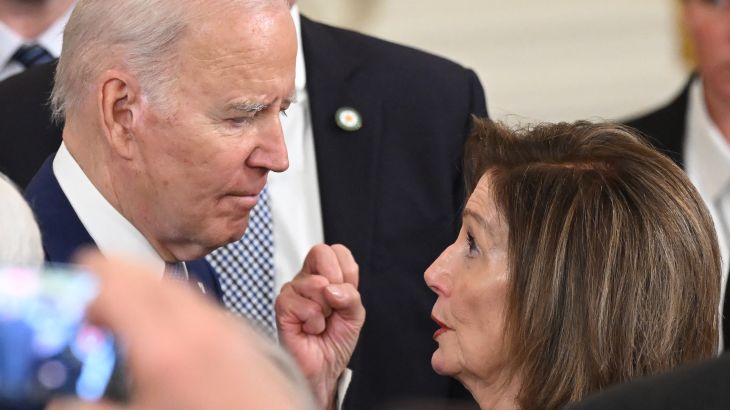 US President Joe Biden talks with US Representative Nancy Pelosi, Democrat of California, after speaking at a ceremony marking the 13th anniversary of the Affordable Care Act in the East Room of the White House in Washington, DC, March 23, 2023. (Photo by SAUL LOEB / AFP)