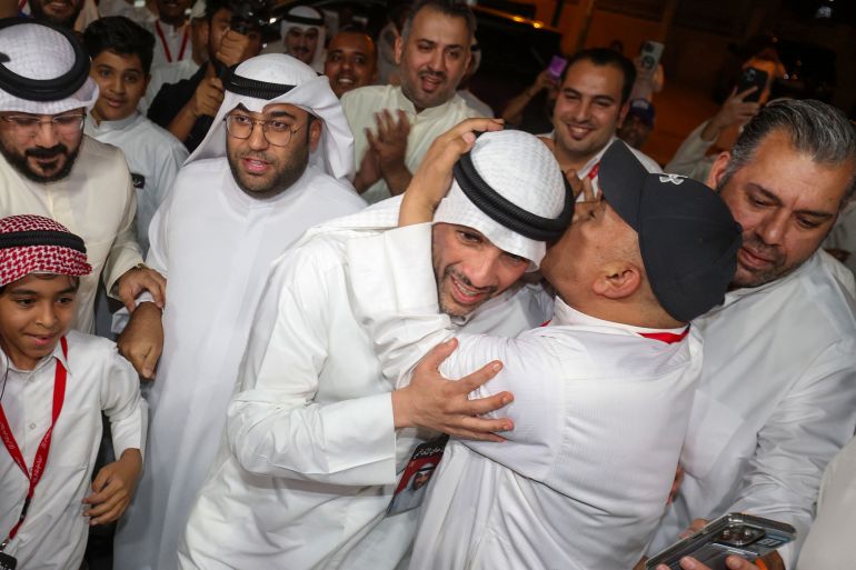 TOPSHOT - Former parliament speaker Marzouq al-Ghanim (C) greets supporters after his victory as a member of parliament in the legislative elections in Kuwait City early on April 5, 2024. Parliamentary polls have become an annual occurrence for Kuwait, the OPEC member country, which boasts seven percent of the world's oil reserves and the Gulf's most powerful elected assembly. (Photo by Yasser Al-Zayyat / AFP)