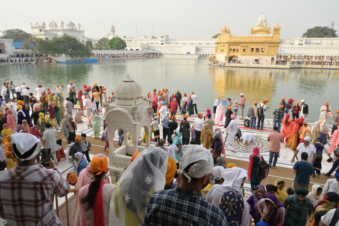 Sikh devotees pay respects on the occasion of 'Baisakhi', a spring harvest festival, at the Golden Temple in Amritsar on April 13