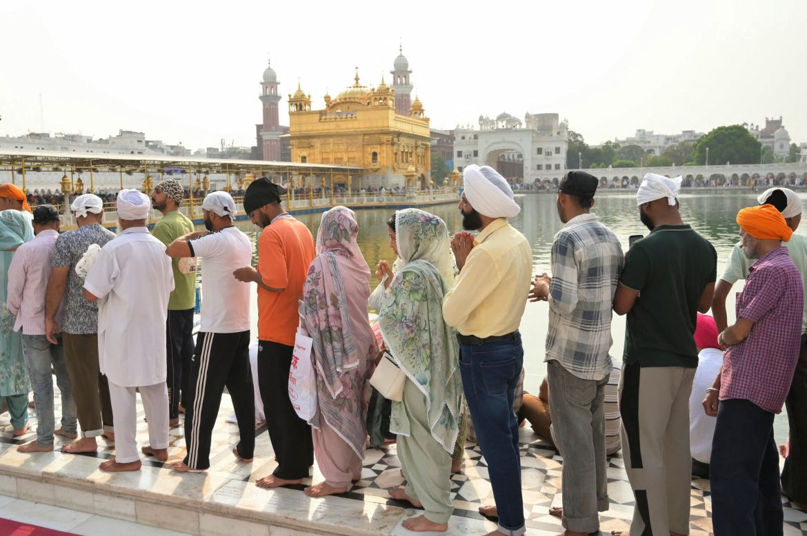 Sikh devotees pay their respects on the occasion of 'Baisakhi', a spring harvest festival, at the Golden Temple in Amritsar on April 13