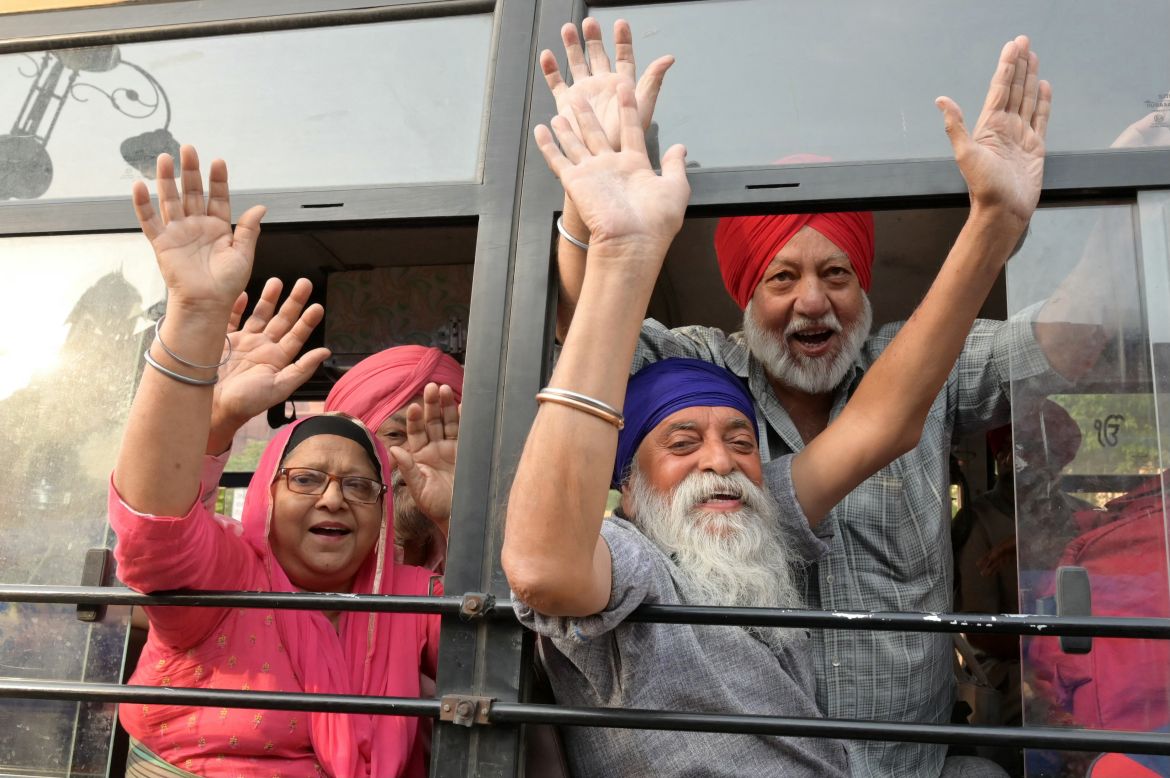 Sikh pilgrims chant slogans as they leave for Pakistan to celebrate 'Baisakhi', a spring harvest festival, in Amritsar on April 13