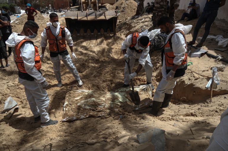 Health workers unearth bodies found at Nasser Hospital in Khan Yunis in the southern Gaza Strip on April 23, 2024 amid the ongoing conflict between Israel and the Palestinian militant group Hamas. (Photo by AFP)