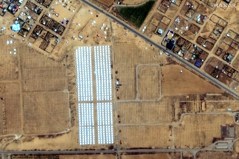 This handout satellite image courtesy of Maxar Technologies shows tent camps for displaced Palestinians in Rafah in the southern Gaza Strip on April 23, 2024, amid the ongoing conflict between Israel and the militant Hamas group. (Photo by Satellite image ©2024 Maxar Technologies / AFP) / RESTRICTED TO EDITORIAL USE - MANDATORY CREDIT "AFP PHOTO / SATELLITE IMAGE ©2024 MAXAR TECHNOLOGIES" - NO MARKETING NO ADVERTISING CAMPAIGNS - DISTRIBUTED AS A SERVICE TO CLIENTS - THE WATERMARK MAY NOT BE REMOVED/CROPPED