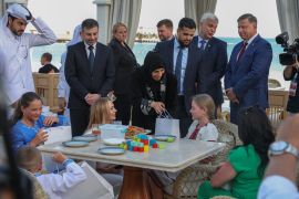 Qatari Minister of State for International Cooperation Lolwah Al-Khater welcomes Ukrainian children and their families in Doha on April 24 [File: Karim Jaafar/AFP]