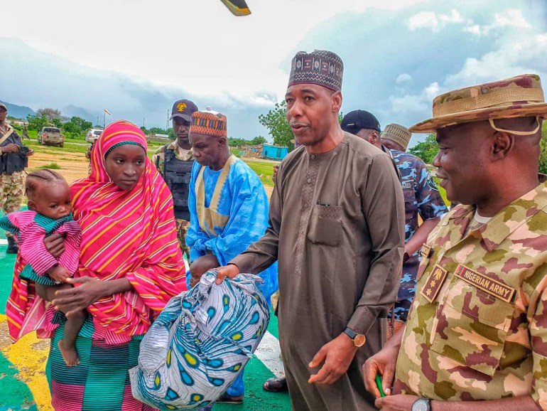 Recently freed Chibok girl stands with Borno governor Babagana Zulum