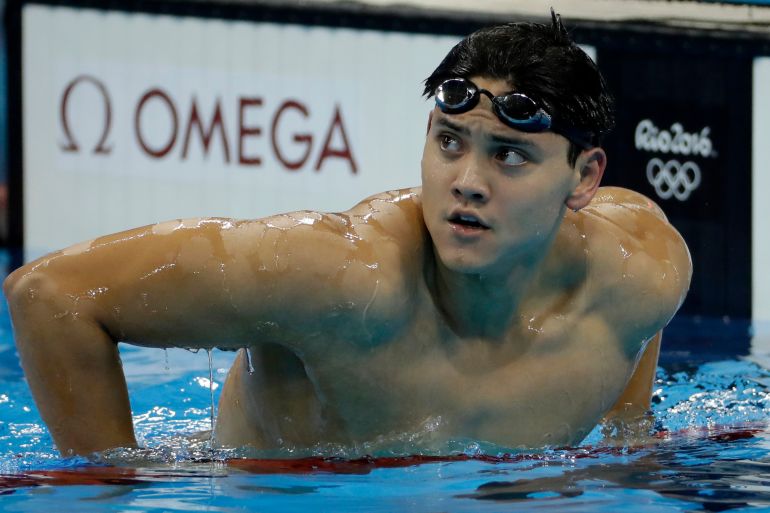 FILE - Singapore's Joseph Schooling looks at the scoreboard after a semifinal of the men's 100-meter butterfly during the swimming competitions at the 2016 Summer Olympics, Thursday, Aug. 11, 2016, in Rio de Janeiro, Brazil. Olympic gold medal swimmer Joseph Schooling has apologized for using cannabis in Vietnam while competing there on leave from military service in his native Singapore. Schooling achieved superstar status in Singapore when he won his country’s first and only Olympic title at the 2016 Rio de Janeiro Games. He won the 100 meters butterfly beating Michael Phelps in the American great’s last Olympic race. (AP Photo/Matt Slocum, File)