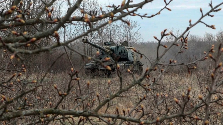 In this photo taken from video released by Russian Defense Ministry Press Service on Tuesday, April 9, 2024, A Russian Army Msta-S, 152.4 mm self-propelled howitzer moves to a position near the border with Ukraine in the Belgorod region of Russia, to fire toward Ukrainian troops. (Russian Defense Ministry Press Service via AP)
