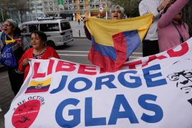 Demonstrators in Quito, Ecuador, call for the release of former Vice President Jorge Glas, who was offered asylum in Mexico [Dolores Ochoa/AP Photo]