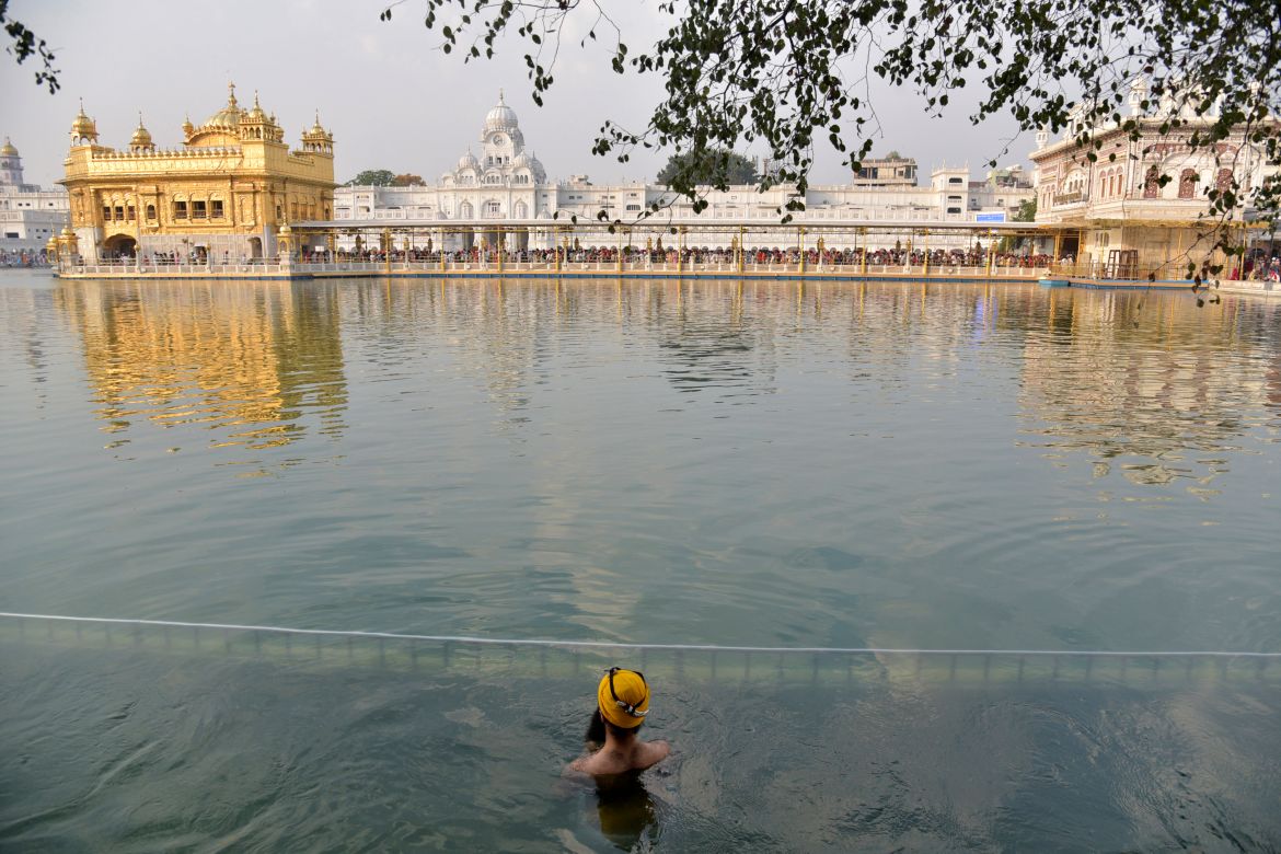 A Sikh devotee takes a dip in the sacred pond at the Golden Temple, Sikhism's holiest shrine, on the occasion of 'Baisakhi', a spring harvest festival for Sikhs and Hindus, in Amritsar, India, Saturday, April 13
