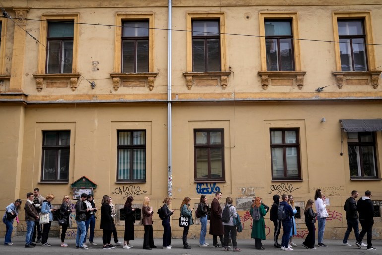 Voters wait near a polling station in ⁢Zagreb