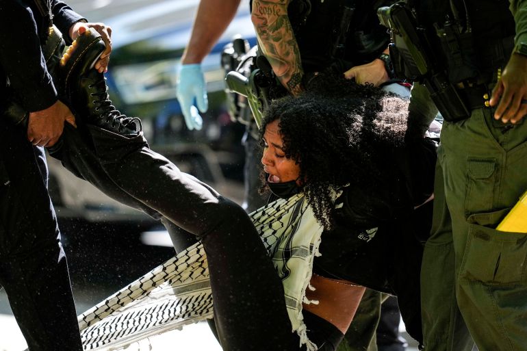 Authorities detain a protester on the campus of Emory University during a pro-Palestinian demonstration, in Atlanta, Georgia, April 25