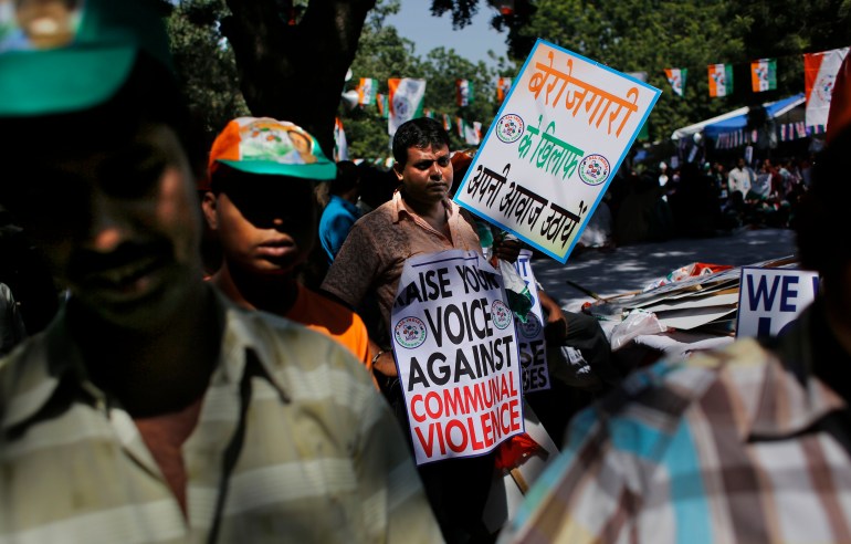 A supporter of All India Trinamool Congress (Youth) participates in an anti-government rally in New Delhi, India, Thursday, Oct. 16, 2014. Hundreds of supporters of All India Trinamool Congress (Youth) participated in a protest rally to highlight rise in communal violence, lack of job opportunities among other problems rampant throughout the country, according to the party press release. Placard reads, "Raise your voice against unemployment". (AP Photo/Altaf Qadri)
