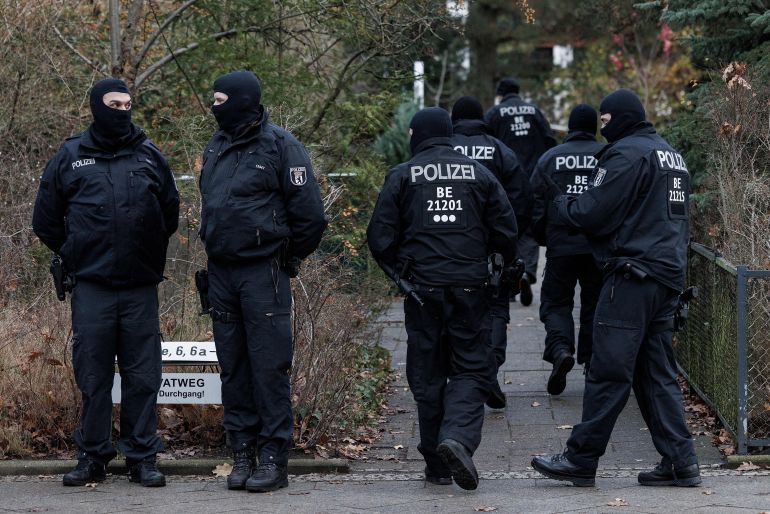 BERLIN, GERMANY - DECEMBER 07: Police stand outside a residence that they raided earlier today on December 7, 2022 in Berlin, Germany