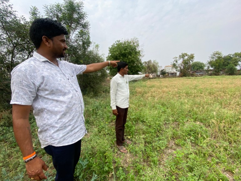 Farmers Ganesh Rathod and Prithviraj Pawar point to the location where Narendra Modi held a political rally in 2014 in his bid to become the country's PM-1714101825