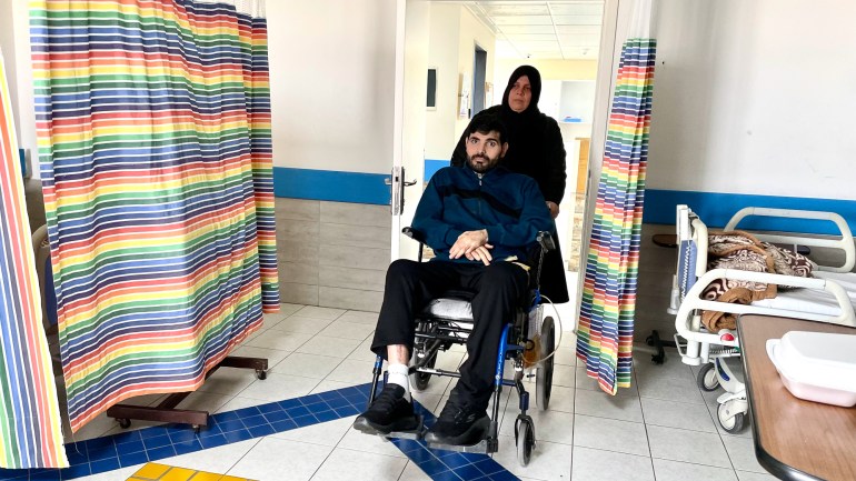 Hanan wheels Fadi into hospital room
