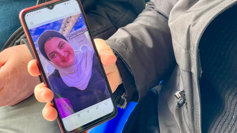 Hanan shows her daughter on her phone