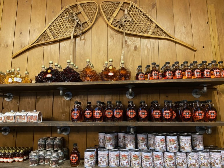 Maple syrup lines a shelf at a sugar shack in Mont-Saint-Gregoire, Quebec, Canada