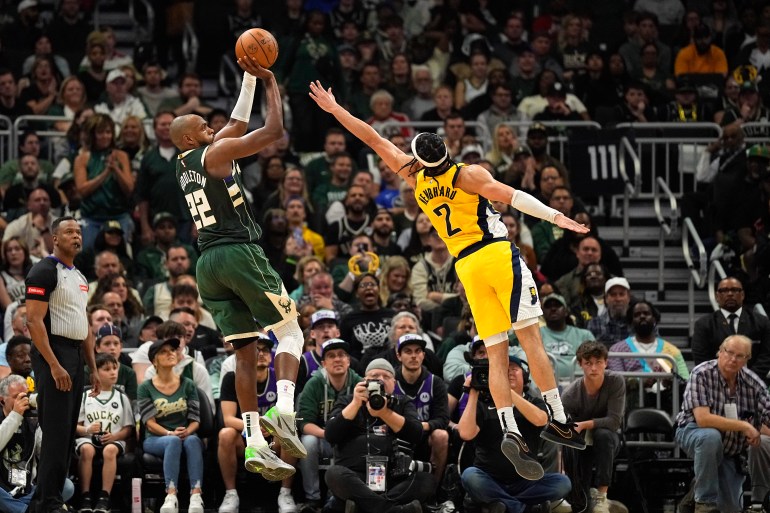 Apr 30, 2024; Milwaukee, Wisconsin, USA; Milwaukee Bucks forward Khris Middleton (22) shoots against Indiana Pacers forward Obi Toppin (1) during the second quarter during game five of the first round for the 2024 NBA playoffs at Fiserv Forum. Mandatory Credit: Jeff Hanisch-USA TODAY Sports